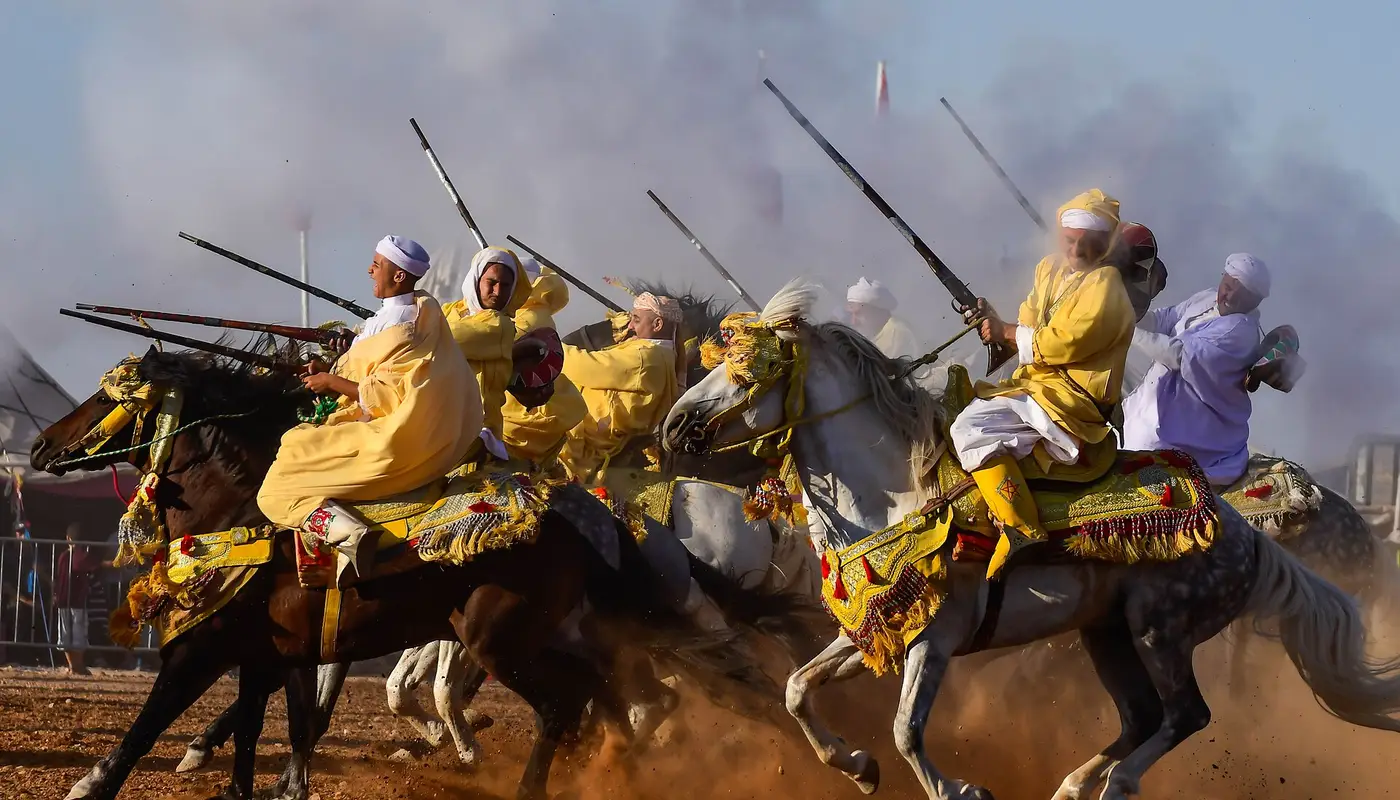 A fantasia: horsemen at full gallop